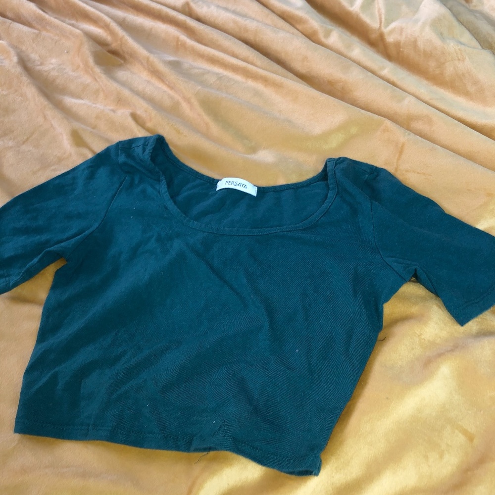 Green crop top with cutout pattern in the back